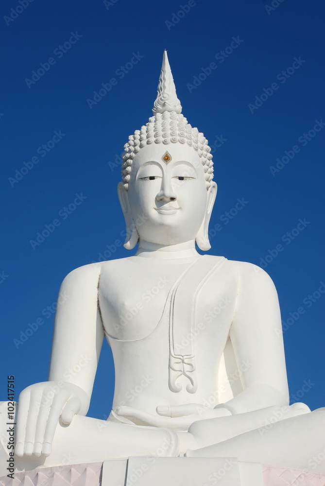 Big white buddha statue on blue sky at Pasak Jolasid Dam, Thailand Big white buddha statue on blue sky at Pasak Jolasid Dam, Thailand