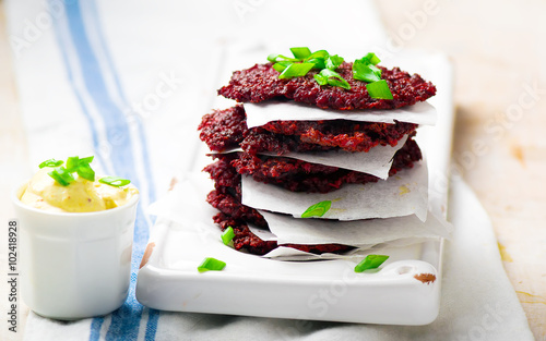 Beet fritters with sauce photo