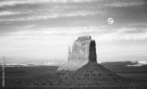 Black and white picture of rock formation in Monument Valley at sunset, US
