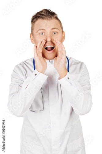Young male doctor in white coat and stethoscope shouting loud,