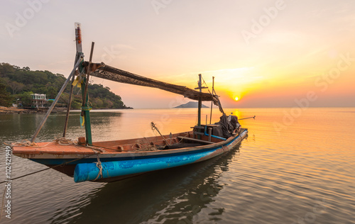 A small boat in sunset time at Ao Yang Beach Chanthaburi Thailan