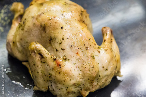 Roasted Beautiful Chicken with Spices on Gray Background, Close-up © toyechkina