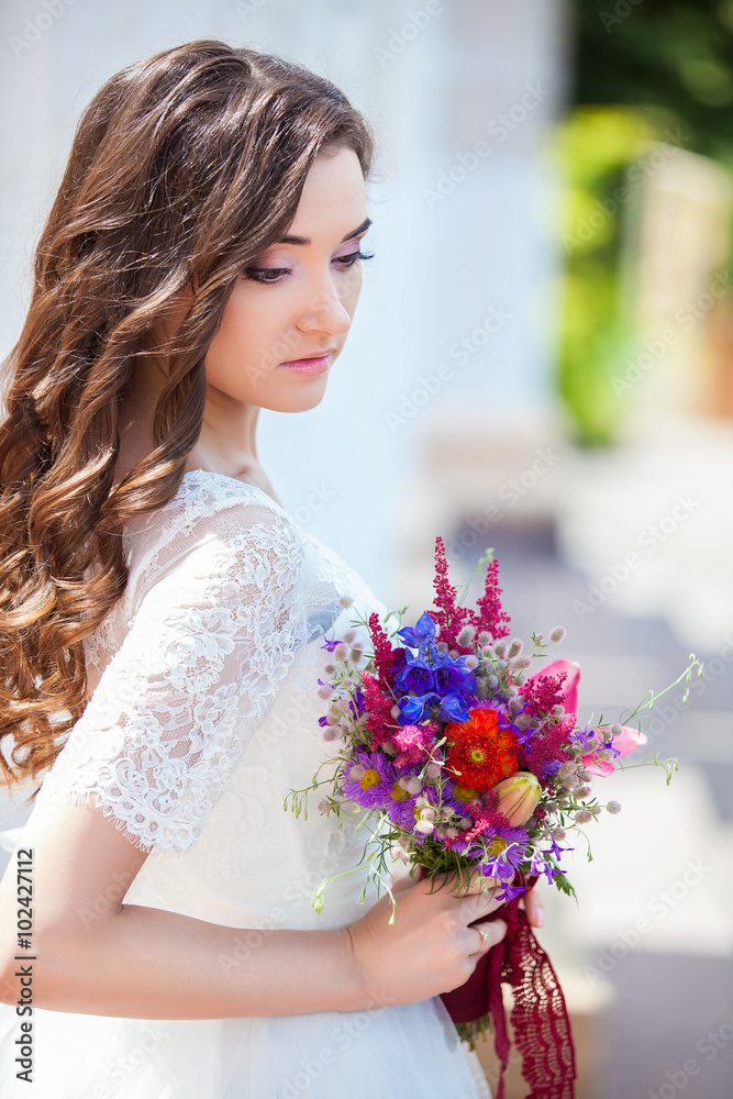 Closeup portrait of young girl with spring flowers Closeup portrait of young girl with spring flowers