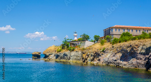small island of saint anastasia is a new tourist attraction in bulgaria near burgas. reconstructed museum, hotel, restaurant and lighthouse are accompanied by small cute beach. photo