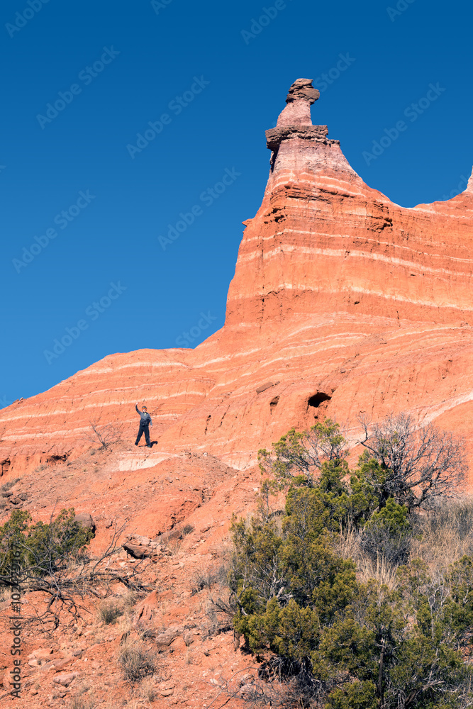 The boy on the hillside Capitol Peak in Palo Duro Canyon State P