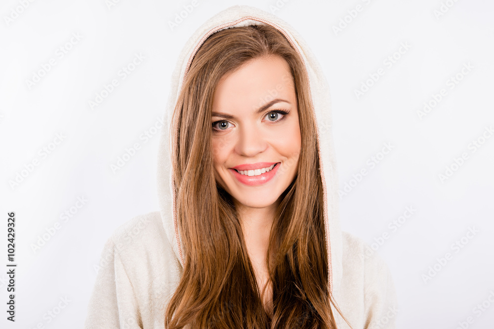 portrait of pretty young girl in bathrobe and hood on her head portrait of pretty young girl in bathrobe and hood on her head