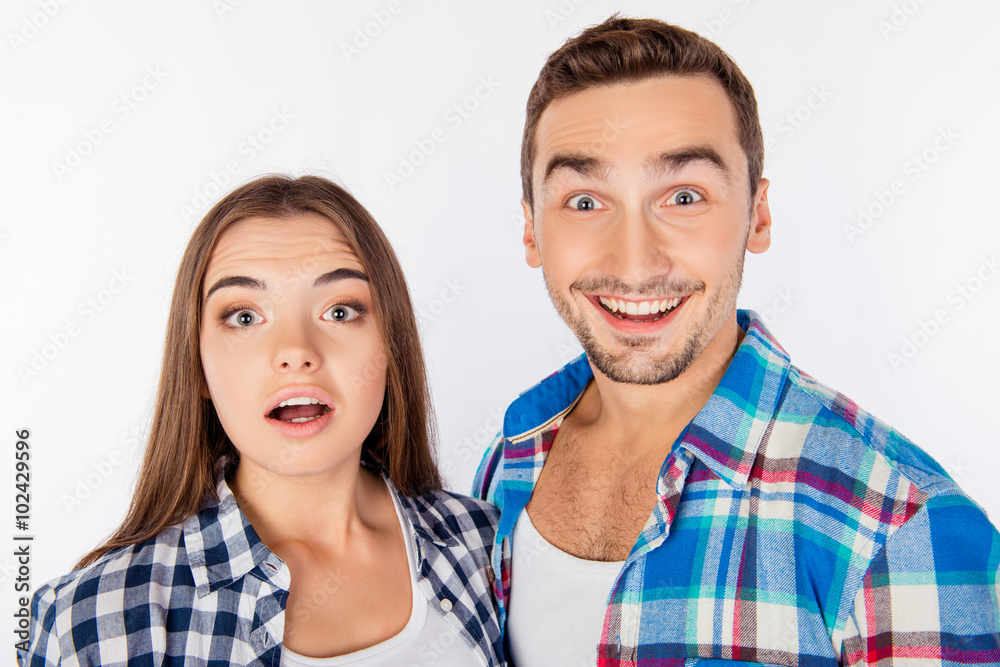 Close up portrait of pleasantly surprised couple in love Close up portrait of pleasantly surprised couple in love
