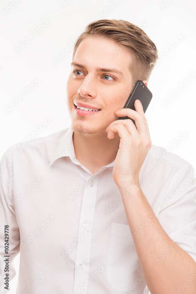 portrait of pretty young businessman talking on his smartphone portrait of pretty young businessman talking on his smartphone