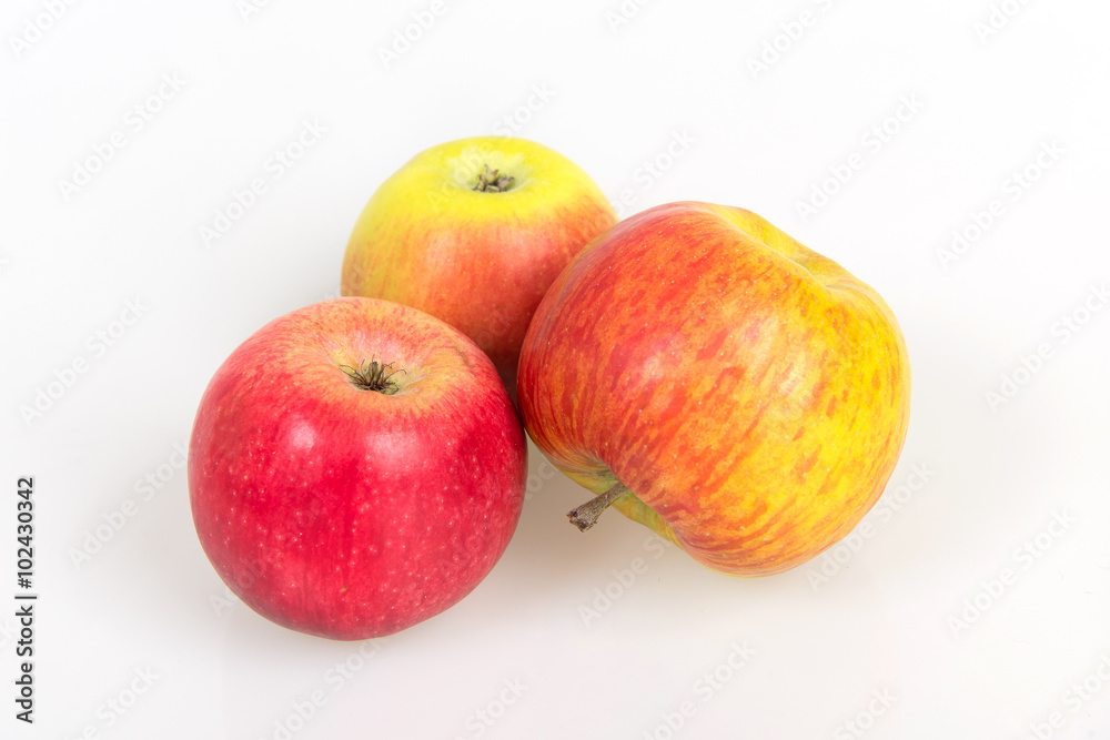 Ripe juicy apples on a white background, harvest from the garden, apple diet to slim figure, vitamin dessert Ripe juicy apples on a white background, harvest from the garden, apple diet to slim figure, vitamin dessert