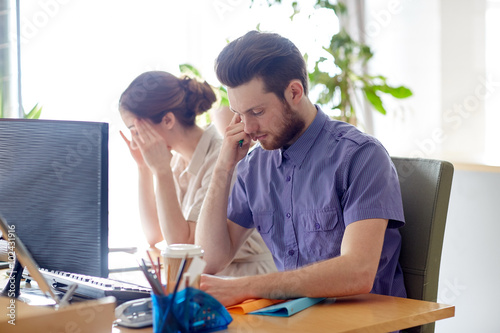 business team with computer and files in office