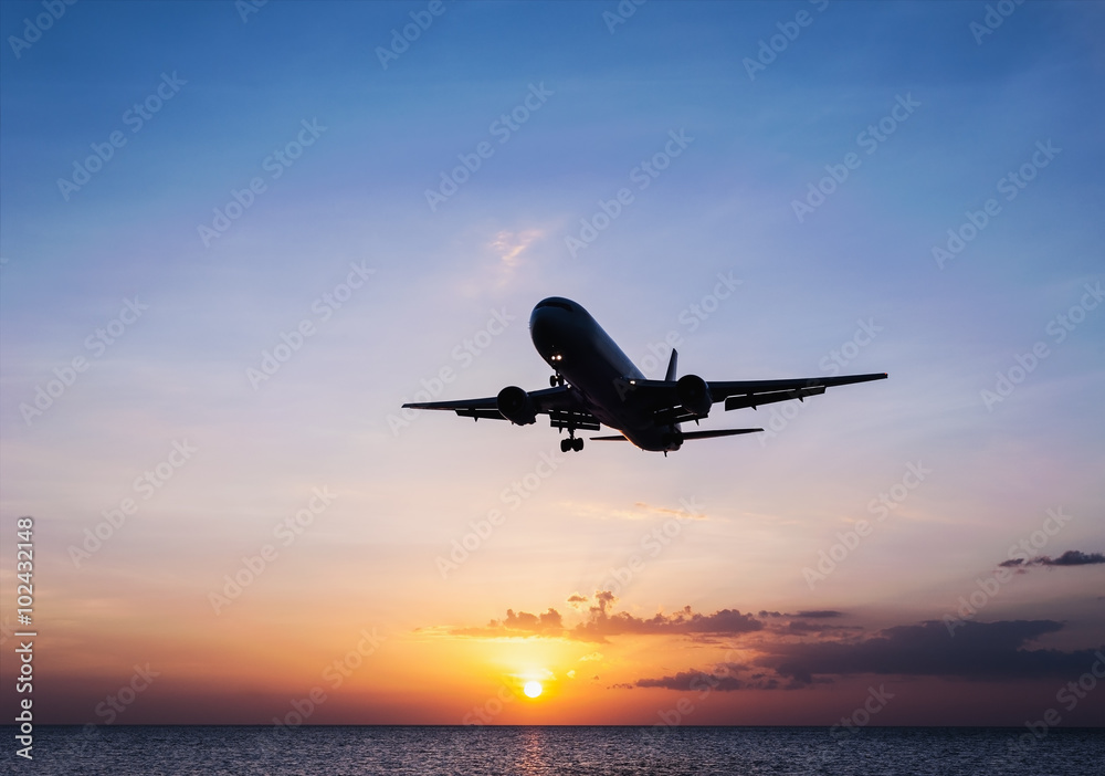 Plane with sky sunset and sea