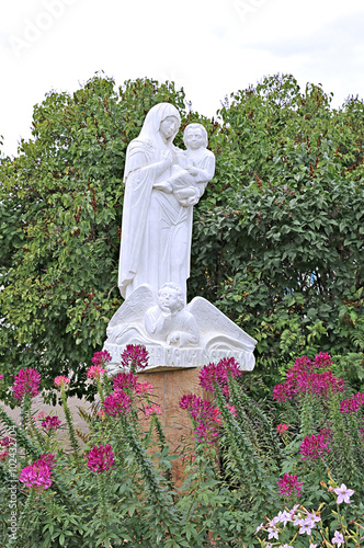 Statue of Mother and Child in Raif monastery garden photo