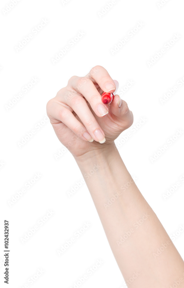Female hand is ready for drawing with red marker Female hand is ready for drawing with red marker