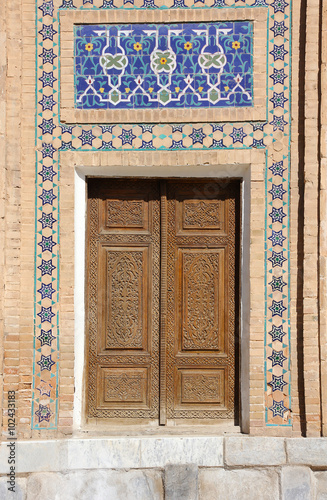 old wooden door with mosaic in the Central Asian style