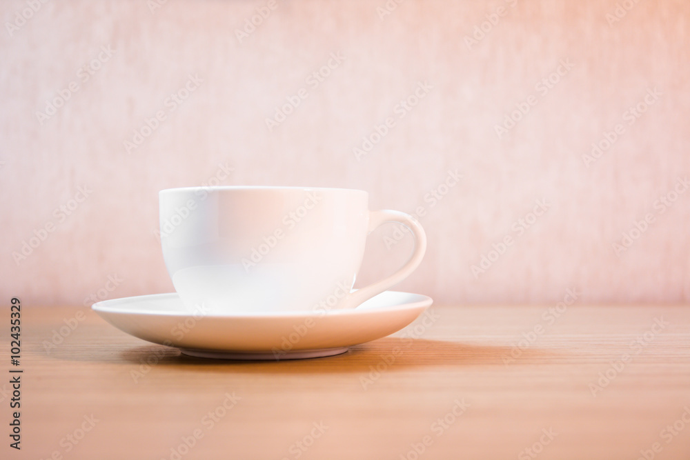 A cup of coffee on wooden background A cup of coffee on wooden background