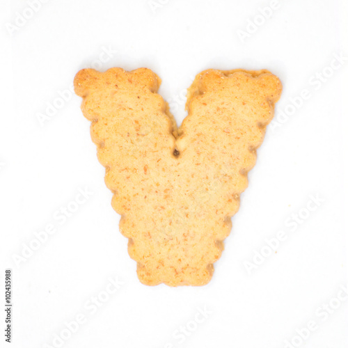 letter V made of cracker cookie isolated on white background.