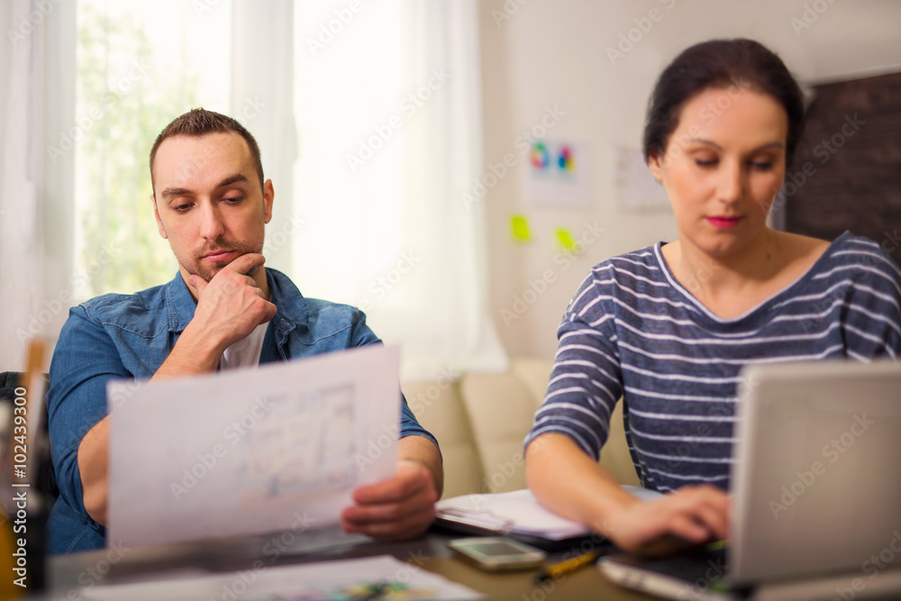 Two designers working together in creative office Two designers working together in creative office