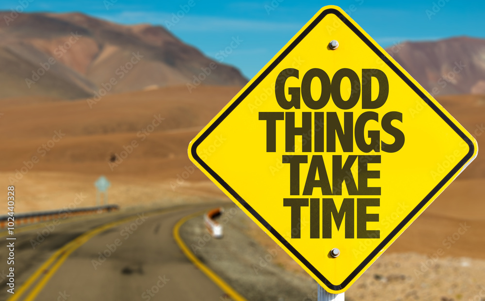 Good Things Take Time sign on desert road