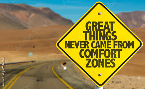 Great Things Never Came From Comfort Zones sign on desert road photo