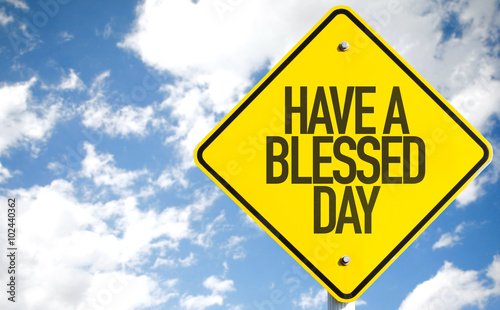 Have a Blessed Day sign with sky background
