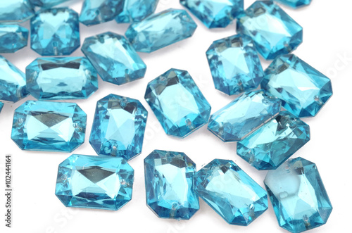 Blue rhinestone on white background