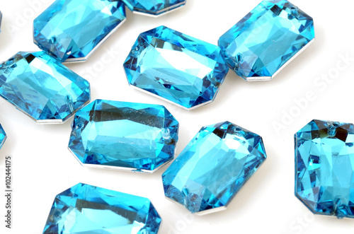 Blue rhinestone on white background