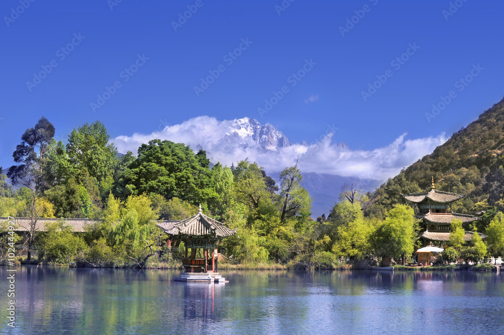 Lake, trees, temples and mountains in China
