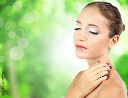 Beautiful young woman on gr...
