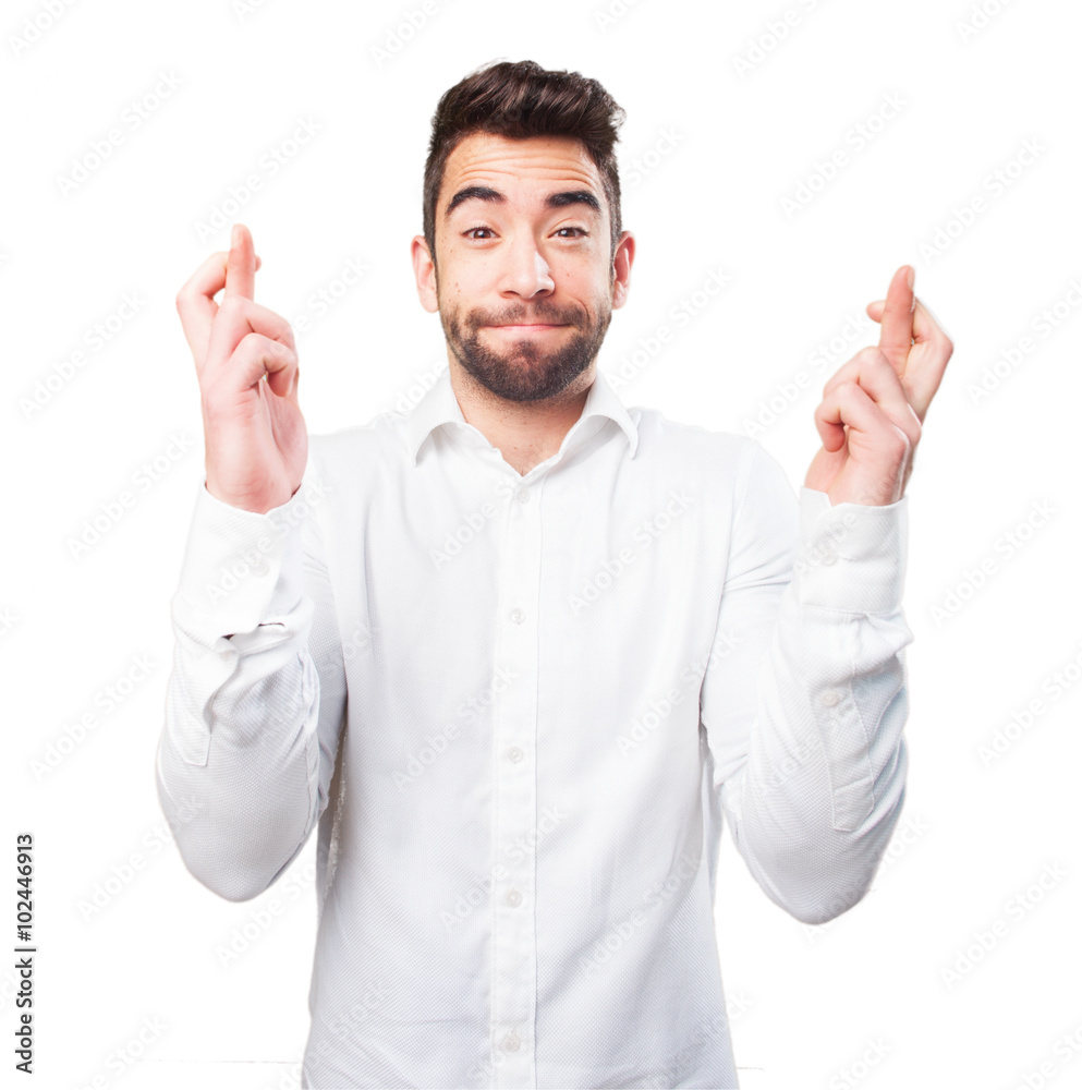 cool young man crossing his fingers