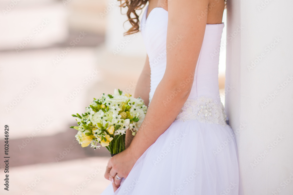 Beautiful bride with bouquet before wedding ceremony Beautiful bride with bouquet before wedding ceremony