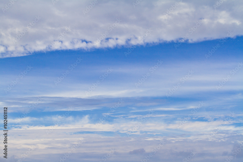 White fluffy row clouds in the sky, background. White fluffy row clouds in the sky, background.