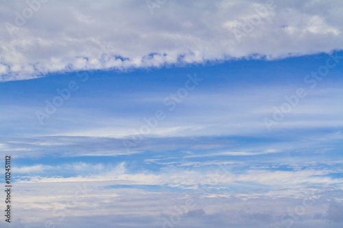 White fluffy row clouds in the sky, background.