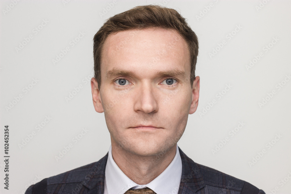 portrait of a caucasian man in thirties serious neutral expression in a suit horizontal view portrait of a caucasian man in thirties serious neutral expression in a suit horizontal view