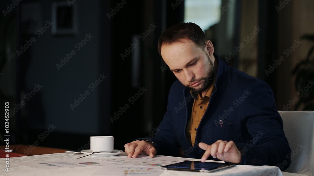 Businessman in the office analyzes financial growth Businessman in the office analyzes financial growth