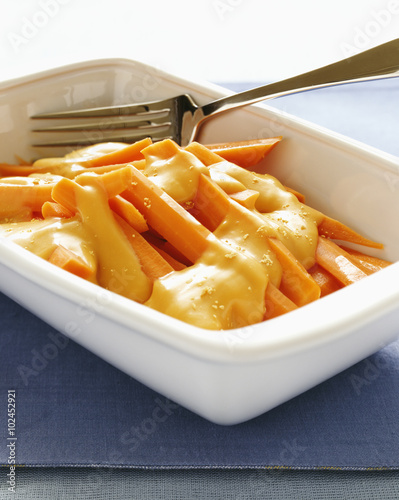 Carrots with chedder cheese sauce photo