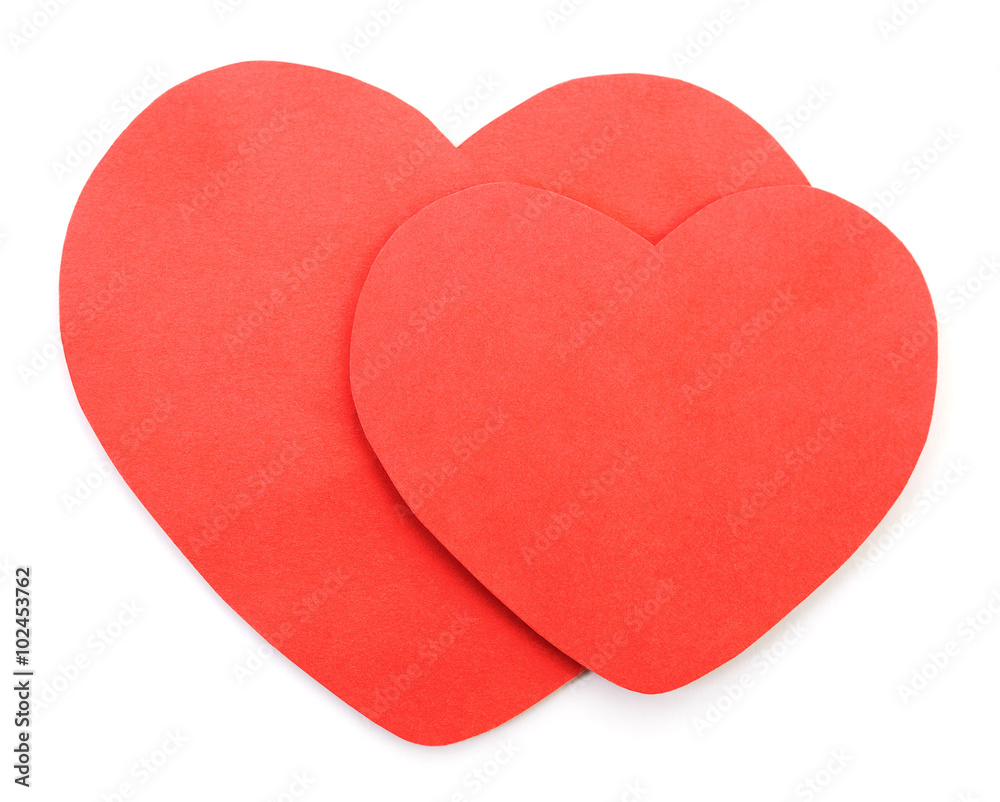Two red paper Valentine`s hearts.