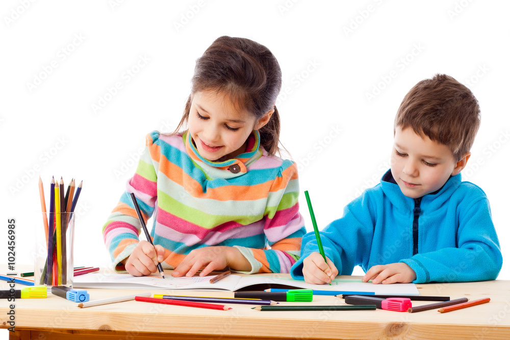 Two little kids draw with crayons together Two little kids draw with crayons together