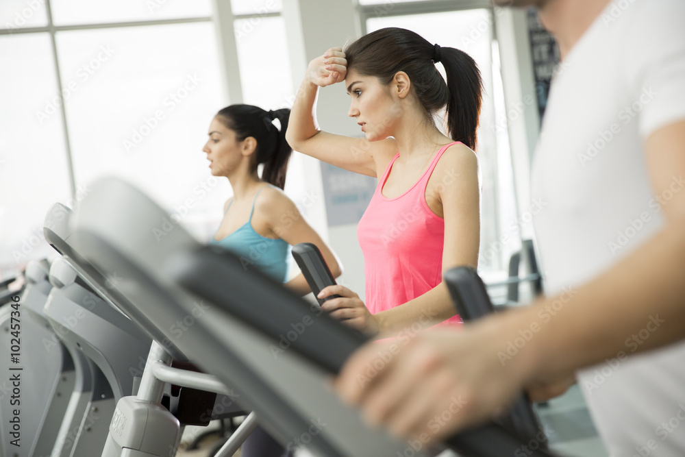 Young people training in the gym Young people training in the gym