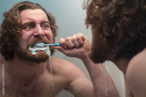 Bearded Man Brushing Teeth