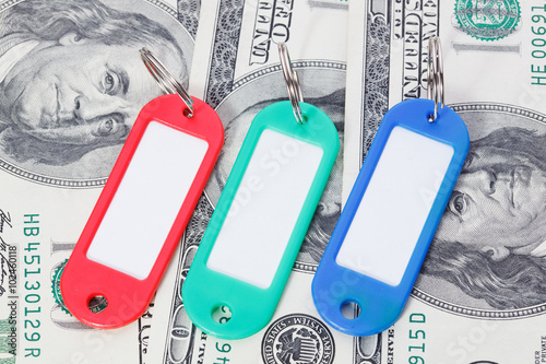 Collection of a colourful key fobs with dollars bills photo