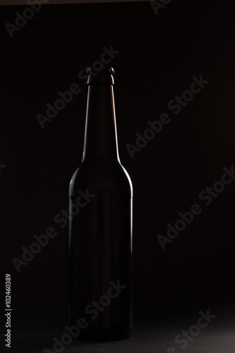 Contour of dark beer bottle