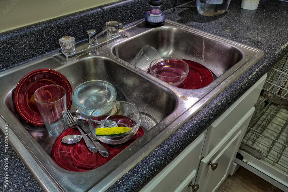 Dirty dishes in a sink