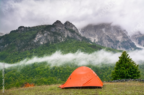 Tourist tent on a background of high mountains