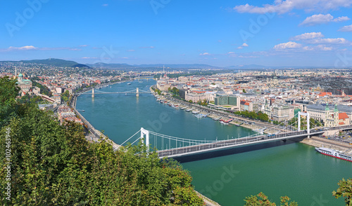 View of Budapest from Gellert Hill, Hungary. The image shows: Buda Castle, Danube with Elisabeth Bridge, Szechenyi Bridge and Margaret Bridge, Hungarian Parliament Building and St. Stephen's Basilica.