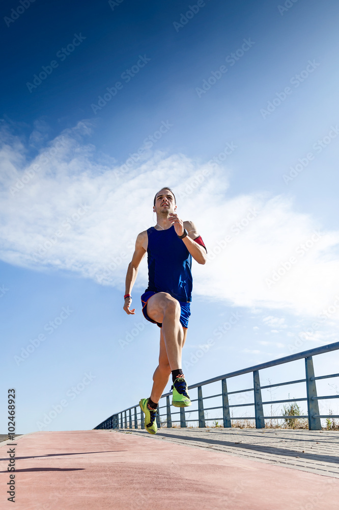 Handsome young man running in the park. Handsome young man running in the park.