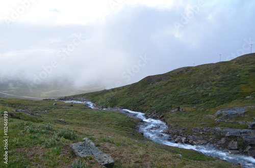 River and hiking trail in mountain valley, subarctic tundra, Swedish Lapland