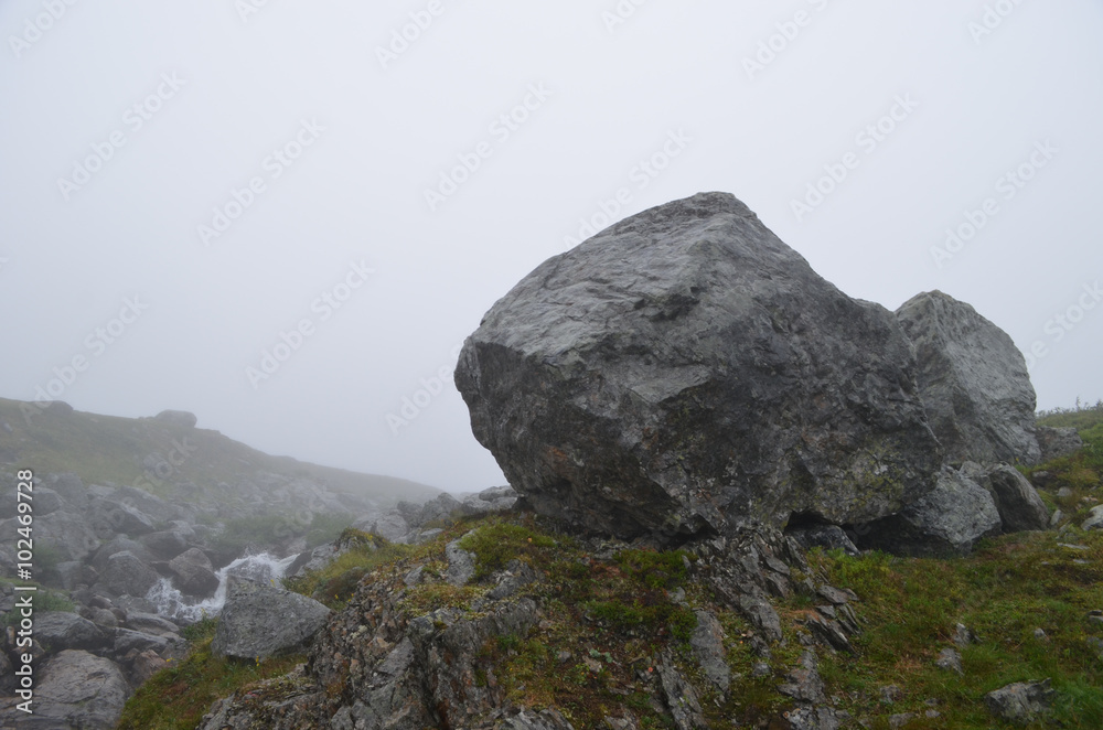 Rock formations in the mist in subarctic alpine tundra, Swedish Lapland