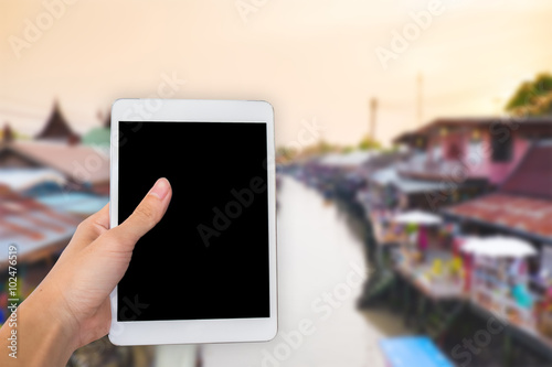 Hands are holding touch screen White Tablet Computer with white background/isolated.