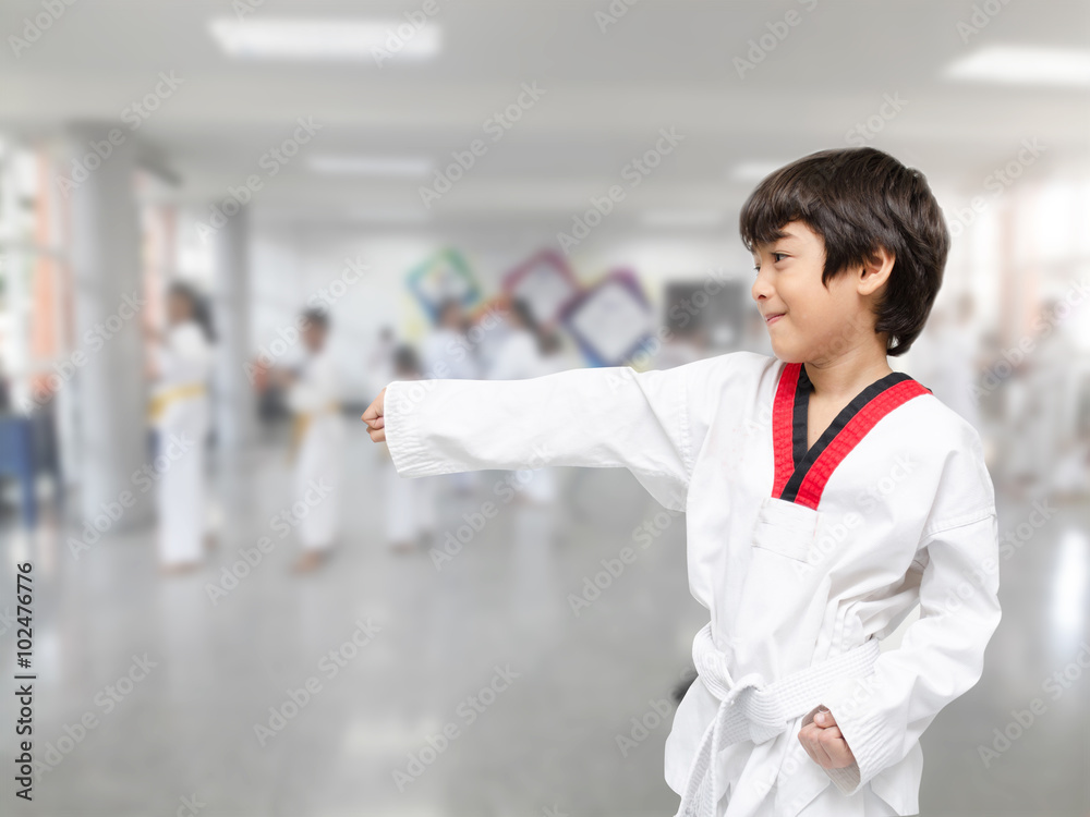 Little boy in taekwondo class