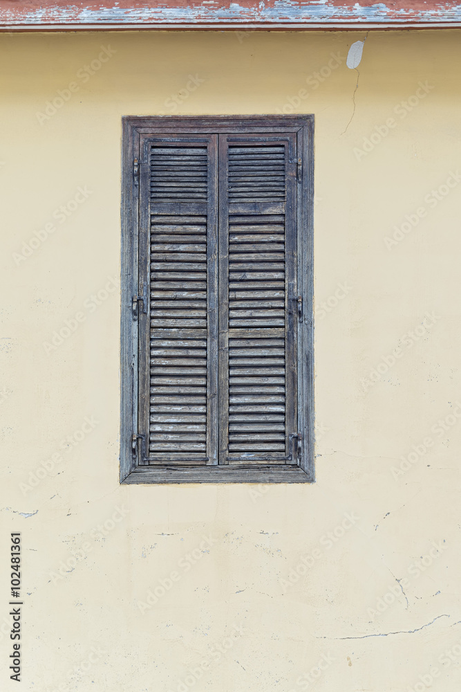 Building face with closed window. Pano Lefkara. Cyprus.
